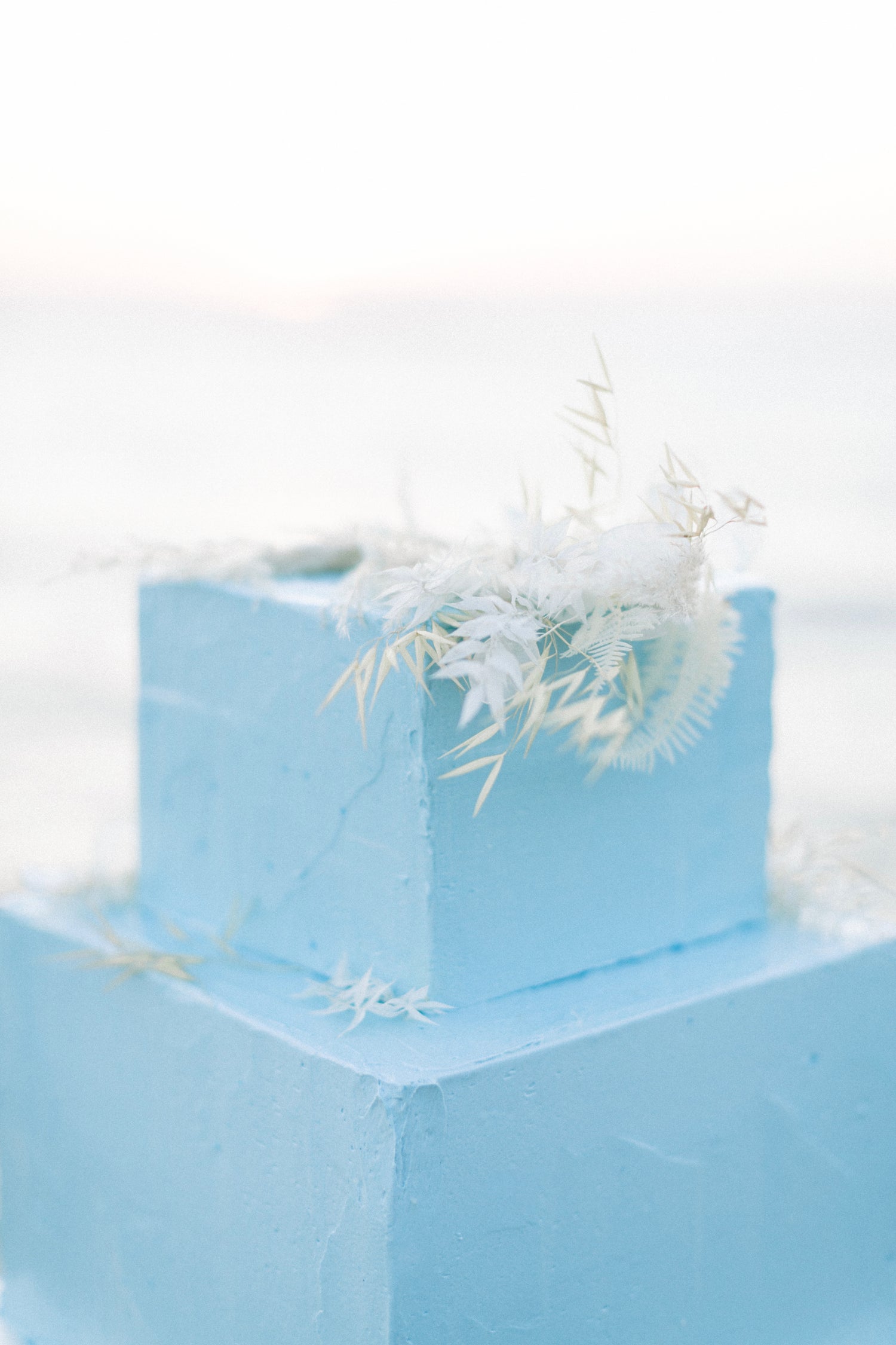 Light blue square wedding cake, dried flowers, wedding in Paros